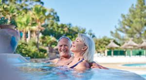 Couple in pool on a Eurocamp holiday